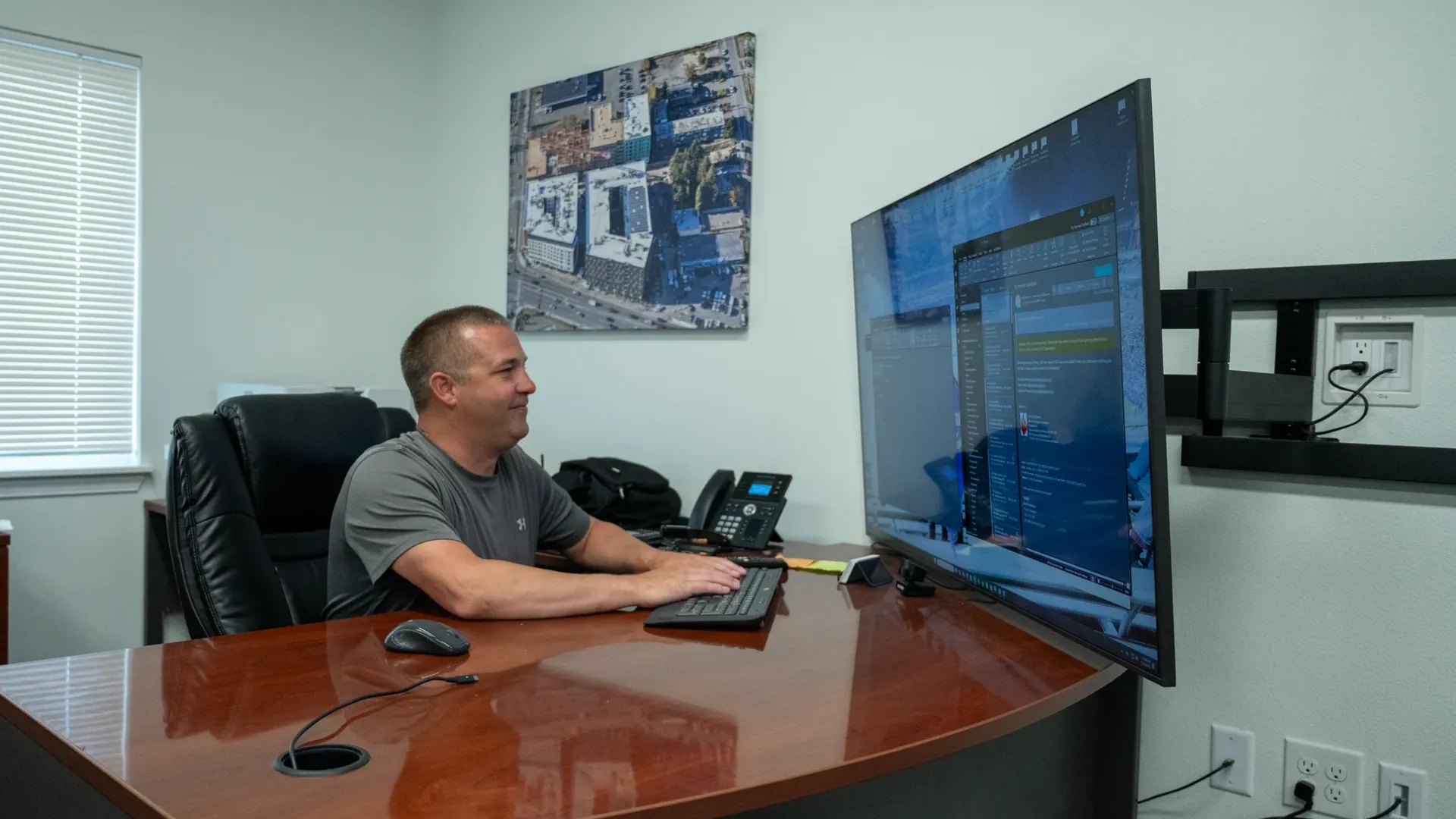 Edison team member working at a dual monitor workstation